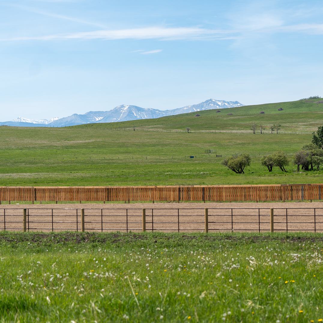 Ranchcore panel fence line on a hillside near Black Diamond, Alberta